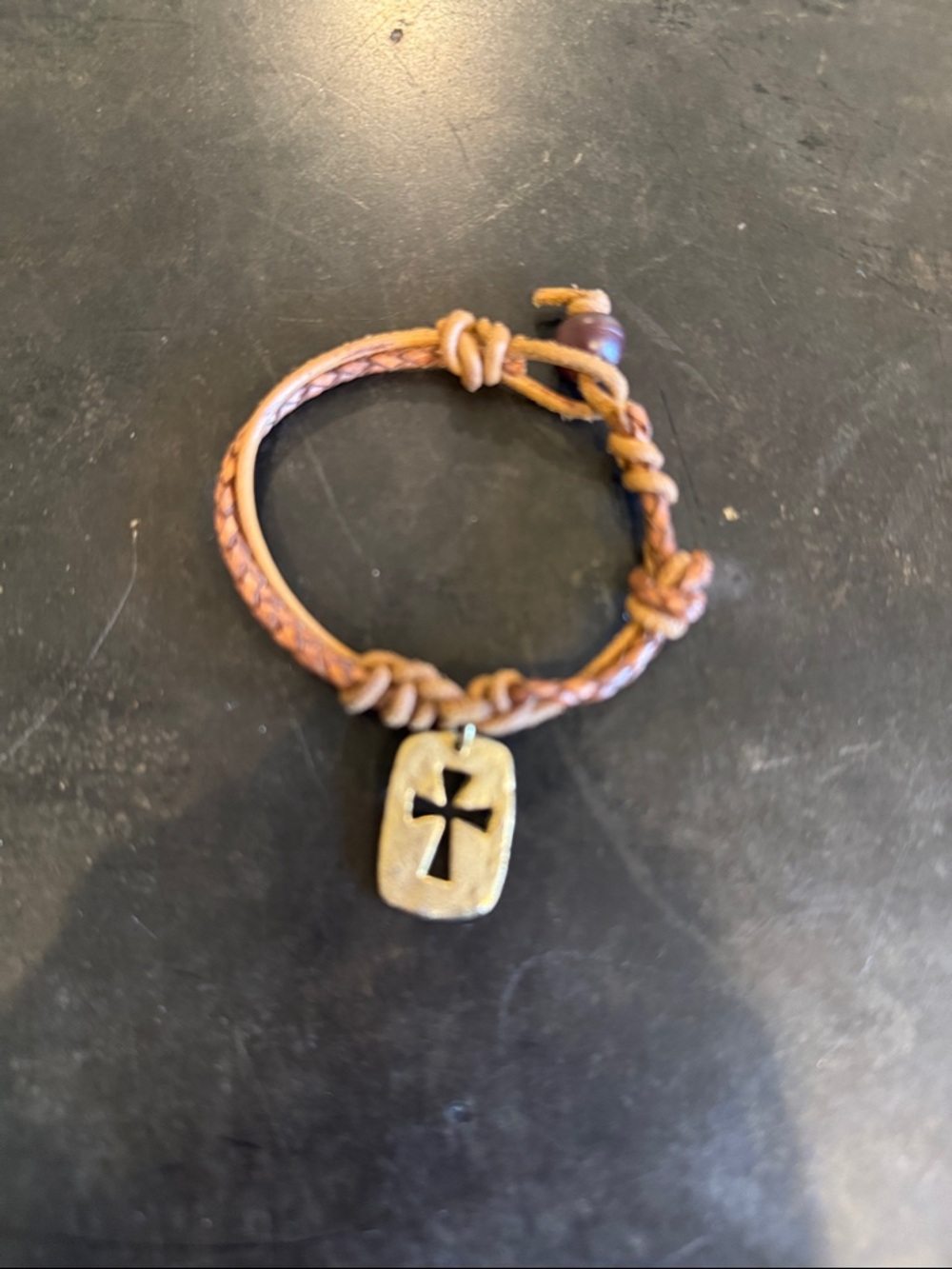 Rope bracelet with gold color cross